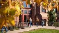 Students leaving academic building in fall
